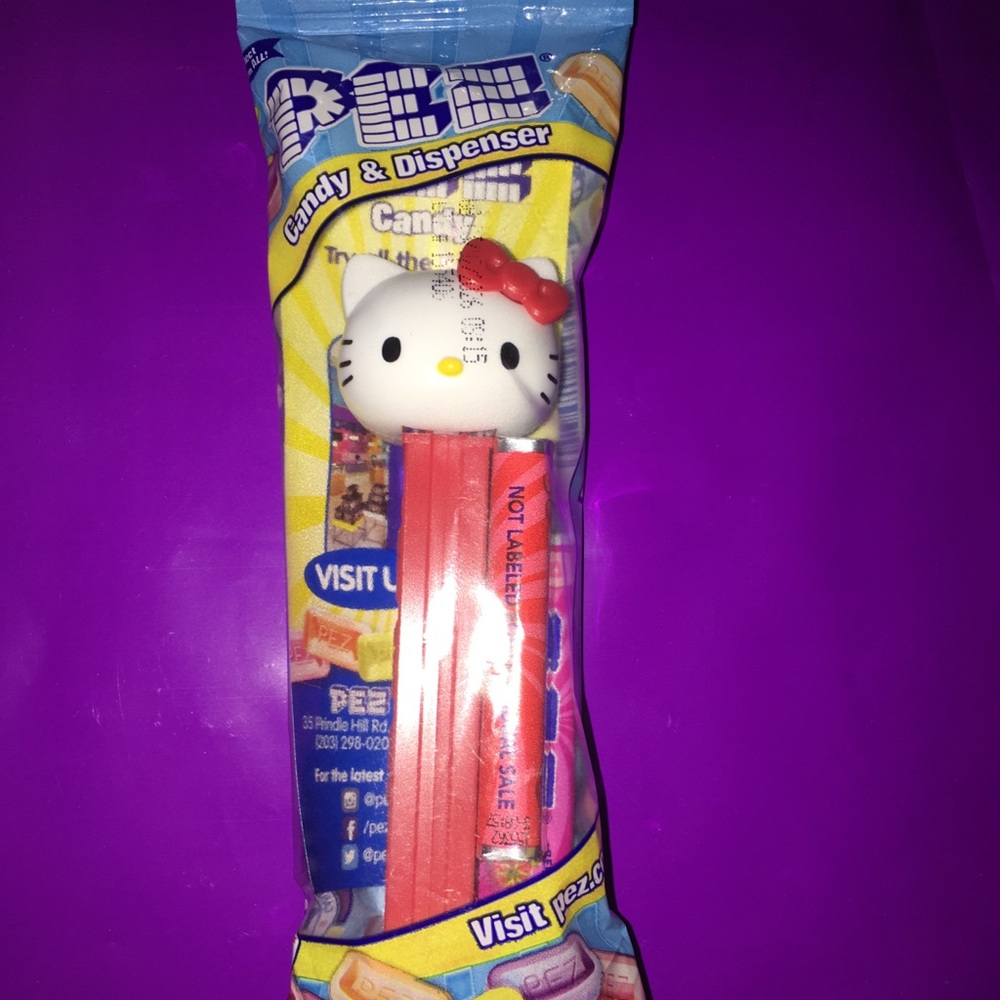 Red Hello Kitty Collectible PEZ dispenser with candy